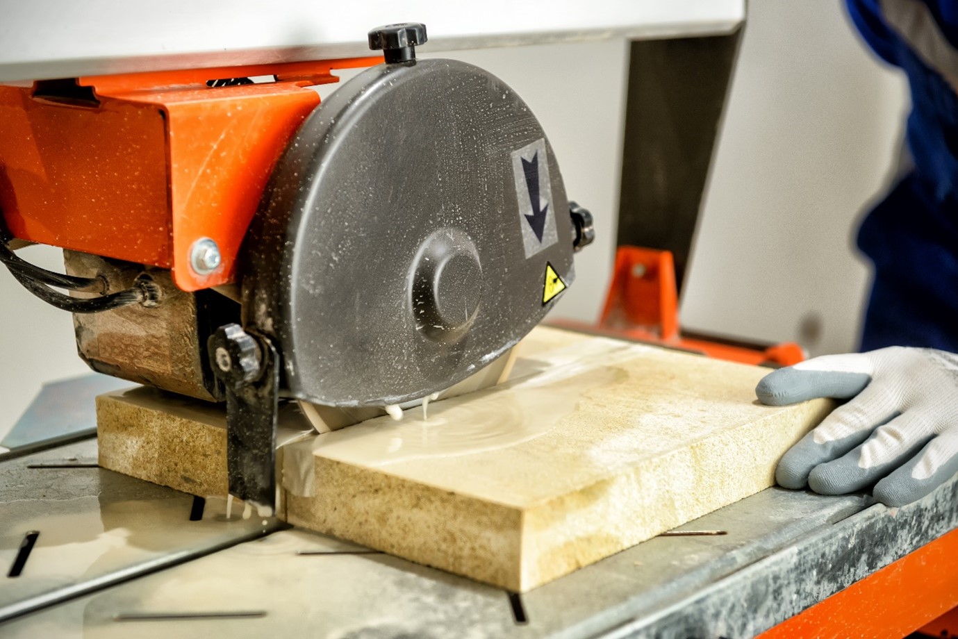 Image 1: Worker cutting engineered stone. worker cutting engineered stone